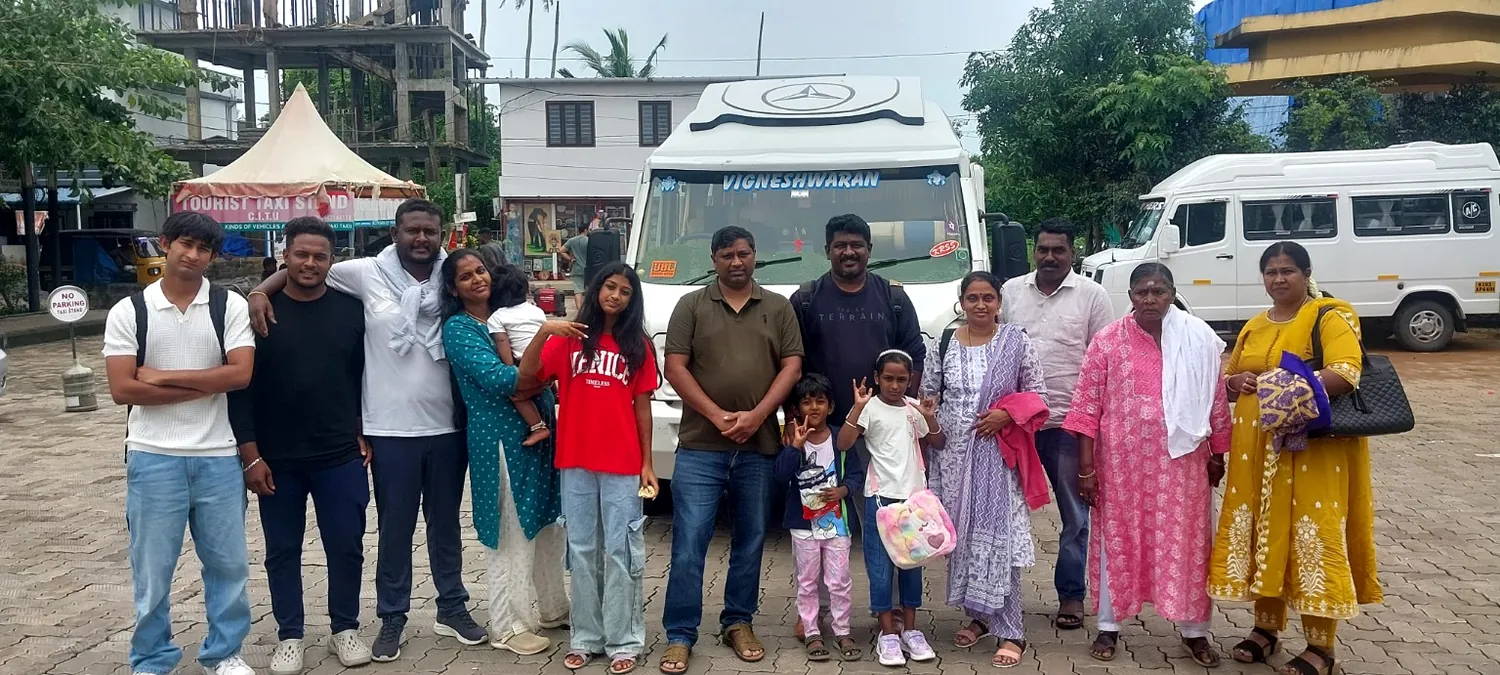 Family tour group with Tempo Traveller