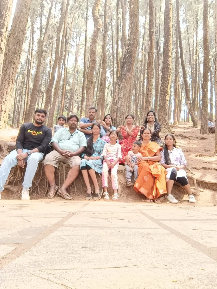 Family moment in pine forest