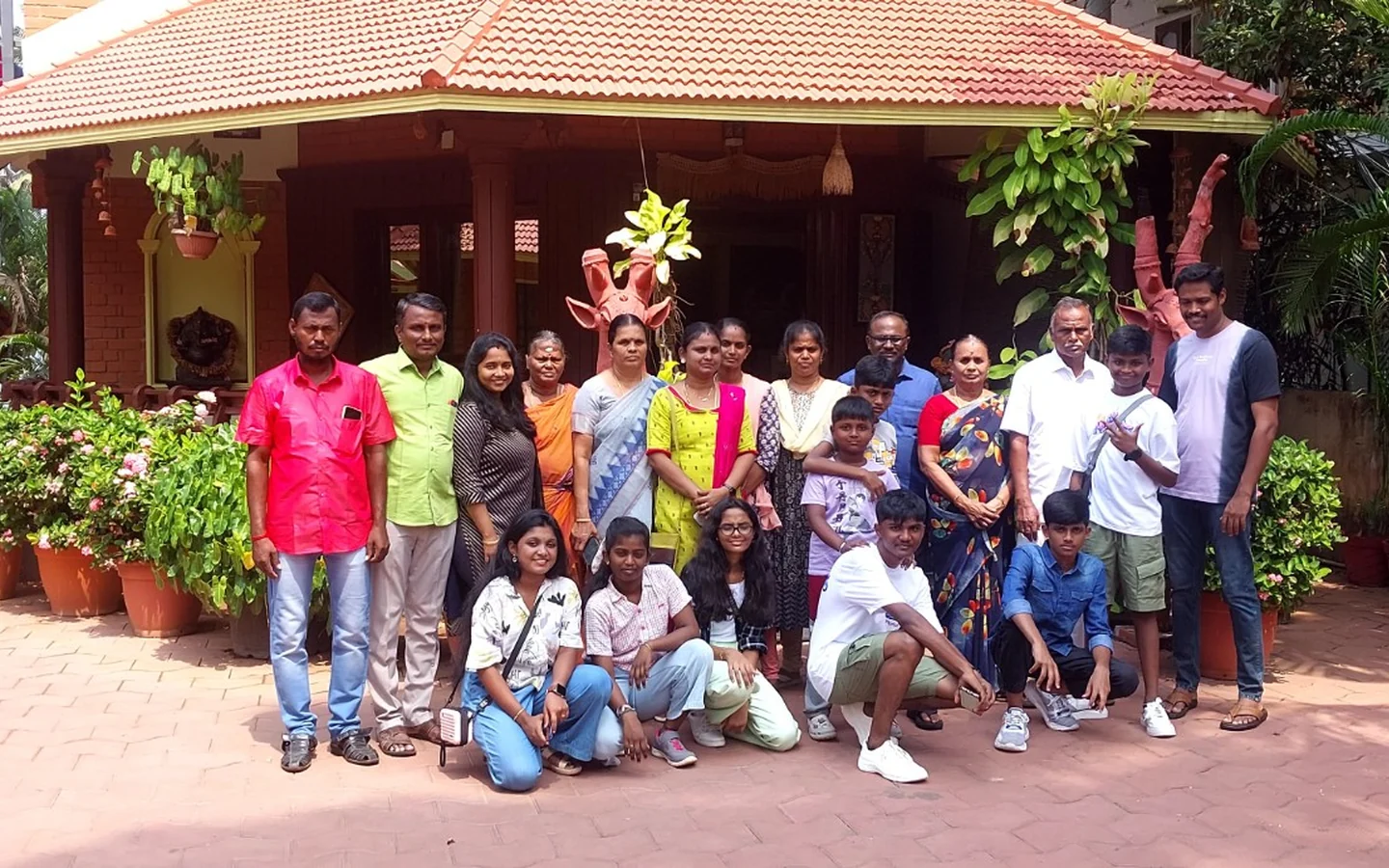 Family group enjoying a tour arranged by Vigneshwaran Tours and Travels