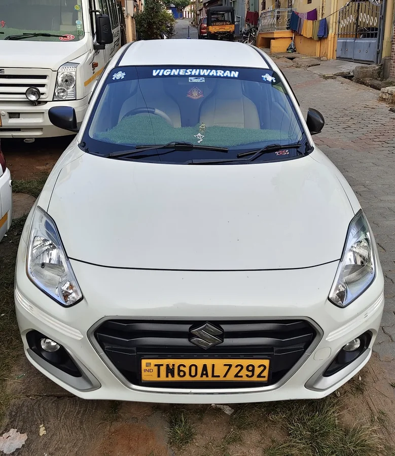 White New Dzire taxi from Vigneshwaran Tours and Travels in Theni