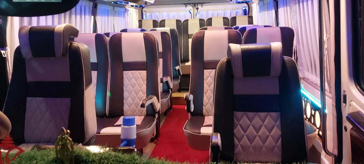 Tempo Traveller interior with pushback seats